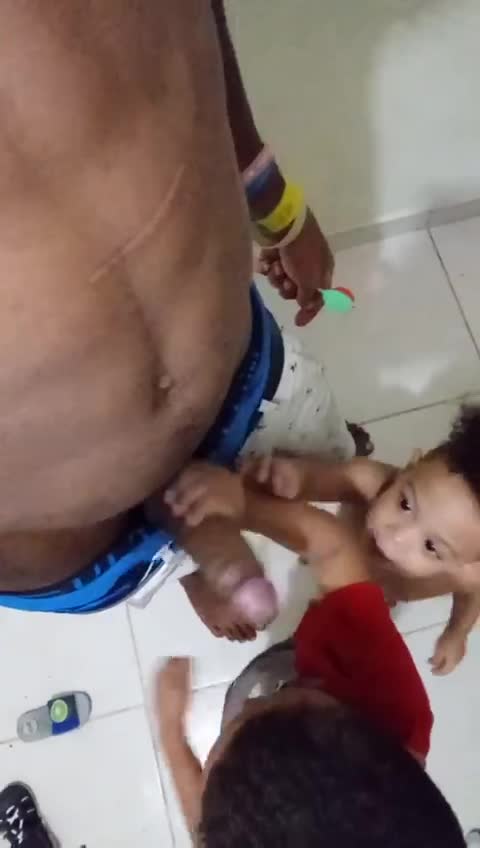 Two toddler kids playing with dady 
