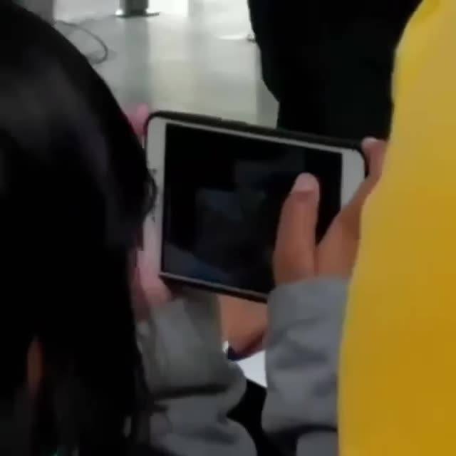 Preteen girl watching porn in public