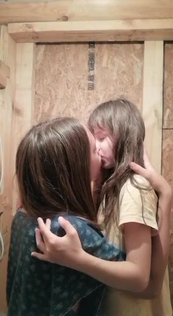 Sisters kissing