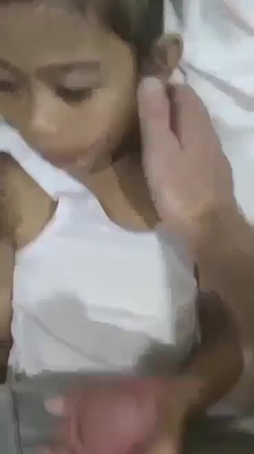 Child in white dress used  by  a guy in room full of kids 