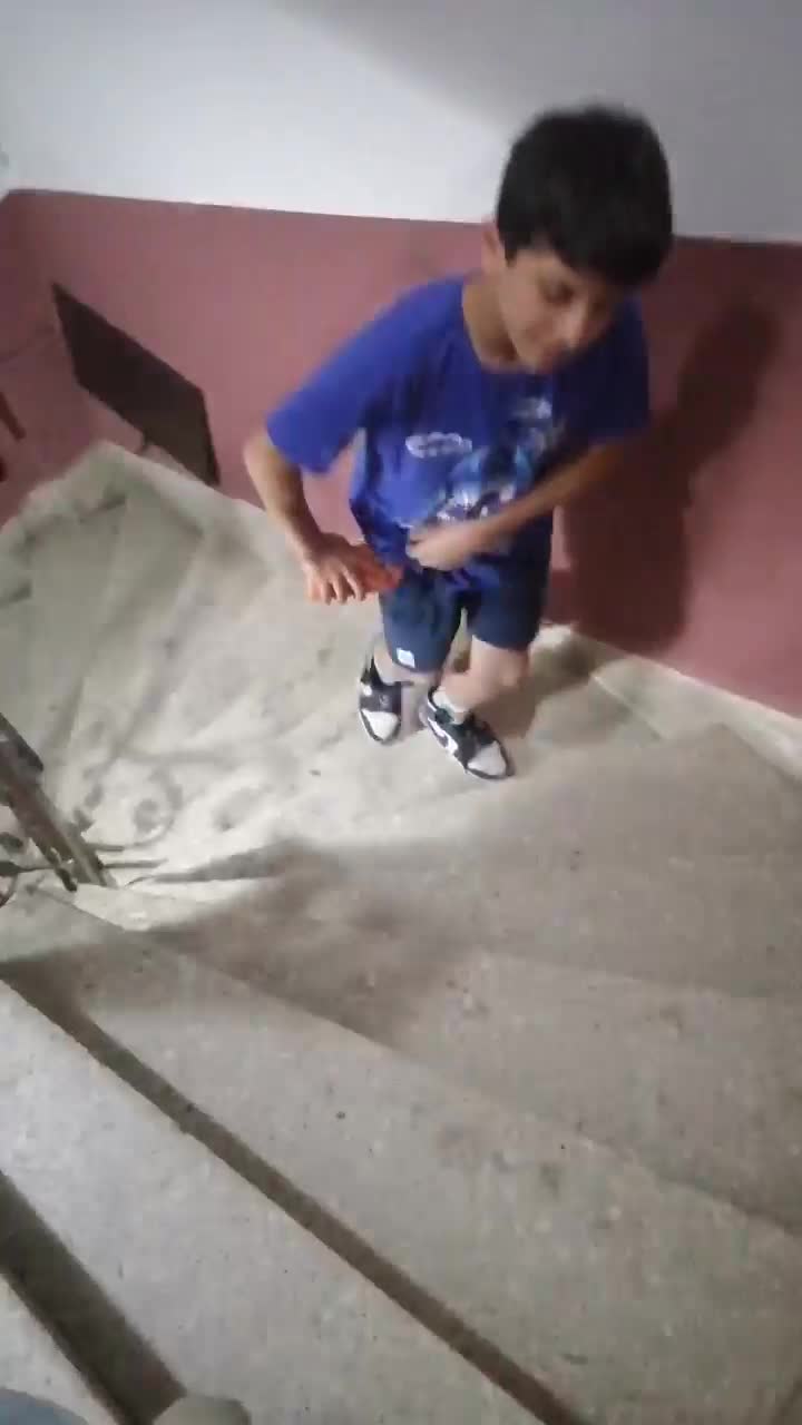 Boy and man at the stairs